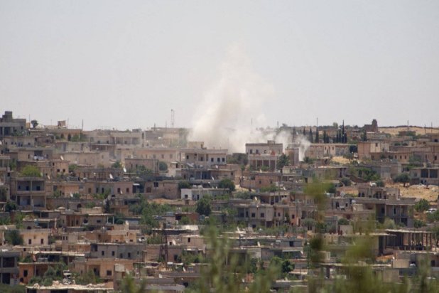 File photo: Smoke billows following reported bombardment by government forces in the Syrian northwestern town of Barah, in the Jabal al-Zawiya region. (AFP)
