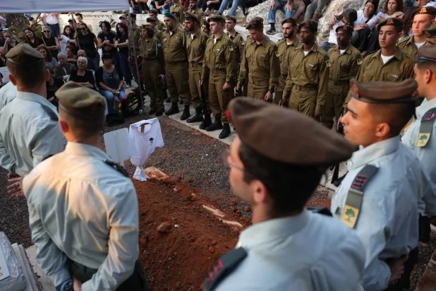 Israeli soldiers attend the funeral of a soldier killed in the battles of South Lebanon. (EPA)
