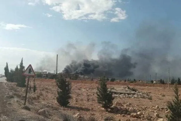 Smoke billows from al-Qusayr in western Syria following an attack. (SANA) 