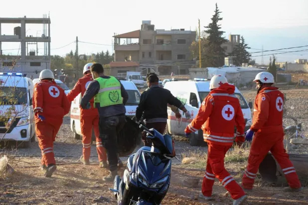 
Lebanese Civil Defense personnel search for victims following an Israeli airstrike on Baalbek, November 14, 2024 (AFP)
