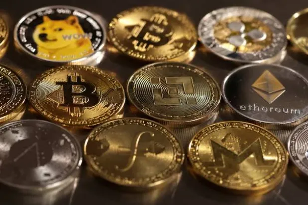 تمثيلات العملات المشفرة في هذا الرسم التوضيحي (رويترز)
