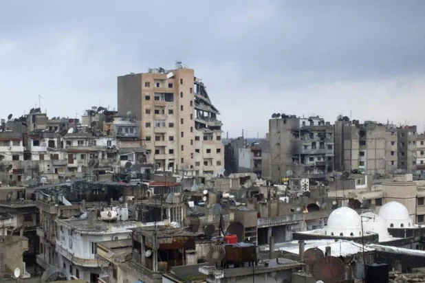 صورة عامة أرشيفية تظهر مباني مدمرة في حمص، سوريا 5 مارس 2013 (رويترز)