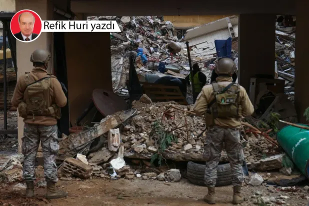 Kurtarma ekipleri Beyrut’un güney banliyösündeki el-Şeyyah mahallesini hedef alan İsrail hava saldırısından sonra hayatta kalanları ararken Lübnan askerleri nöbet tutuyor, 19 Kasım 2024 (AFP)