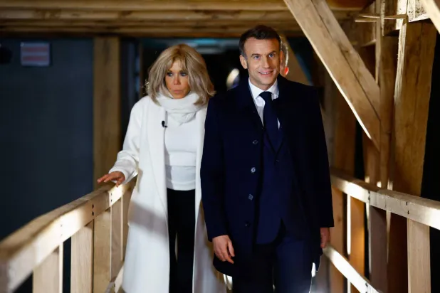 President Emmanuel Macron and his wife, Brigitte, during their visit to Notre-Dame Cathedral to inspect restoration work following the fire that struck in spring 2019 (AFP)
