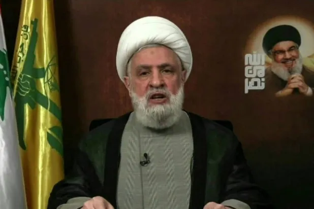 An image grab shows Hezbollah chief Naim Qasem delivering a televised speech from an undisclosed location. AFP