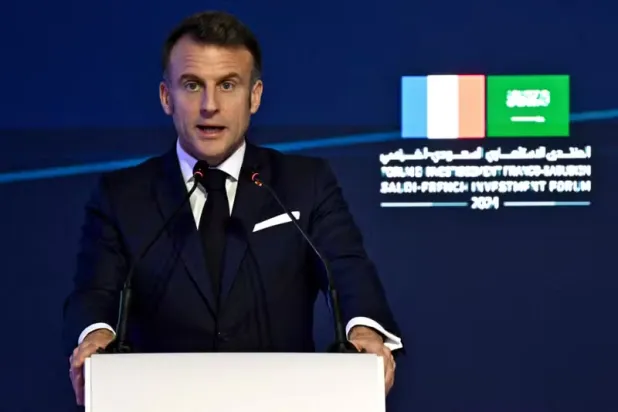 French President Emmanuel Macron speaks during the Saudi-French Business Forum during an official visit in Riyadh on December 3, 2024. JEANNE ACCORSINI / AFP