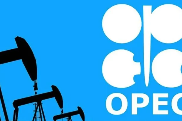 A model of oil rigs in front of the OPEC logo (Reuters)
