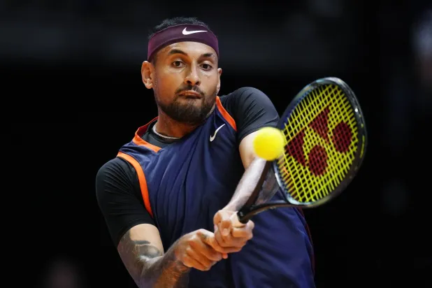 FILE - Nick Kyrgios of Eagles returns the ball to Grigor Dimitrov of Falcons during a match of Day 3 of the World Tennis League at Coca-Cola Arena in Dubai, United Arab Emirates, on Dec. 21, 2022. (AP Photo/Kamran Jebreili, File)