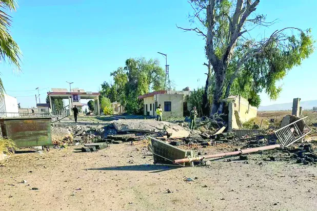 A photo taken from the Syrian side of the border with Lebanon shows the aftermath of an Israeli strike on the Jusiyeh border crossing with Quseir in Syria's central Homs province on October 25, 2024. (Photo by AFP)