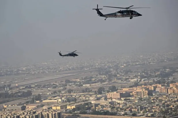  
US helicopters accompany Secretary Antony Blinken as he heads to the US Embassy in Baghdad on December 13, 2024 (Reuters)
