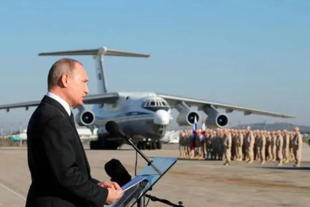 Russian President Vladimir Putin inspecting his troops at Hmeimim Airbase in Latakia on December 12, 2017 (Sputnik/AP)