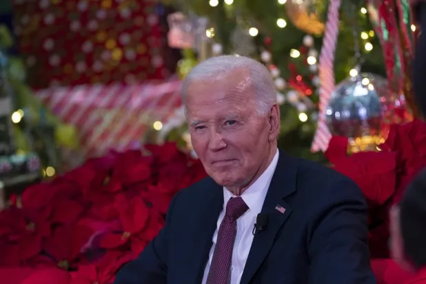 United States President Joe Biden participates in a holiday visit to patients and families at Children's National Hospital in Washington, DC, USA, 20 December 2024. (EPA)
