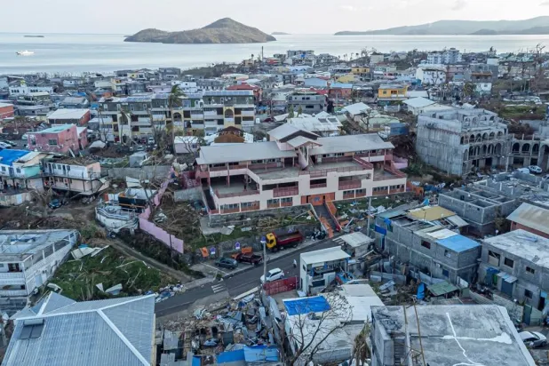 This aerial view shows damaged buildings in the city of Mamoudzou, on the French Indian Ocean territory of Mayotte, on December 21, 2024, after cyclone Chido hit the archipelago. (AFP)