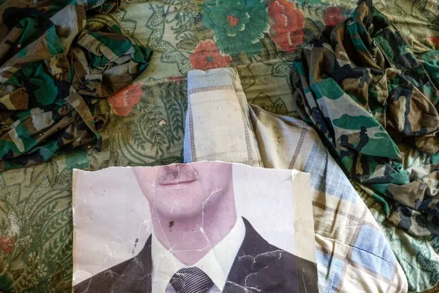 A defaced portrait of ousted Syrian President Bashar al-Assad is seen in Damascus, Syria, 18 December 2024 (issued 22 December 2024). (EPA) 