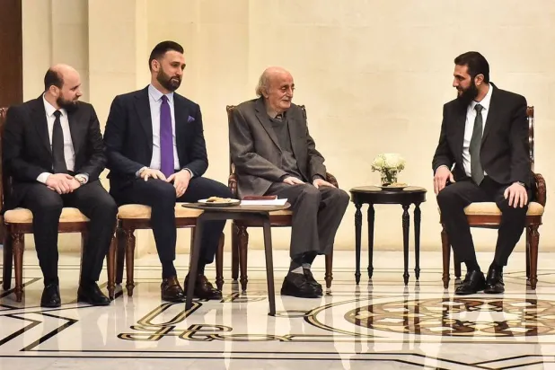 Walid Jumblatt (C), the Druze former leader of Lebanon's Progressive Socialist Party (PSP), and his son and current party head Taymur Jumblatt (C-L) meet with Syrian leader Ahmed al-Sharaa (R) and interim prime minister Mohammad al-Bashir (L) during a visit to Damascus on December 22, 2024. (AFP) 