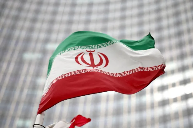 FILE PHOTO: Iranian flag flies in front of the UN office building, housing IAEA headquarters, in Vienna, Austria, May 24, 2021. REUTERS/Lisi Niesner/File Photo