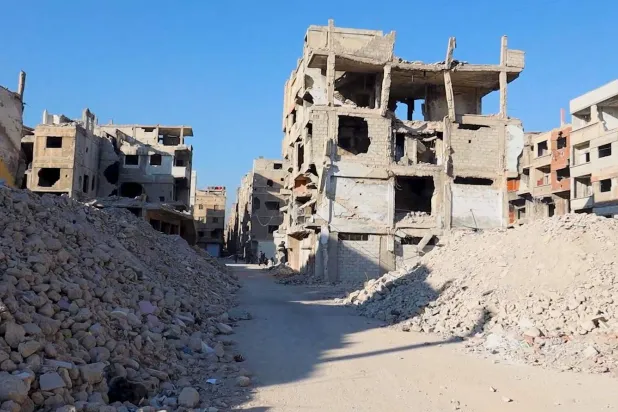 The destruction within Syria’s Yarmouk camp mirrors the scenes of war in Gaza (Asharq Al-Awsat)