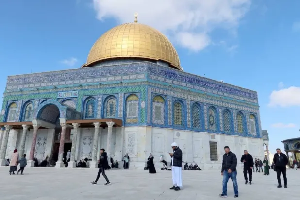 Muslim worshippers walk in front of the Dome of the Rock ahead of Friday prayer in the al-Aqsa compound in Jerusalem's Old City February 9, 2024. (Reuters)
