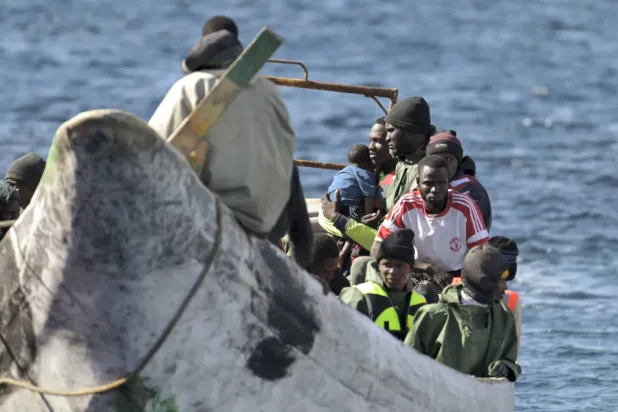 Guards on the Canary Islands during the rescue of a boat carrying 57 illegal immigrants (EPA)