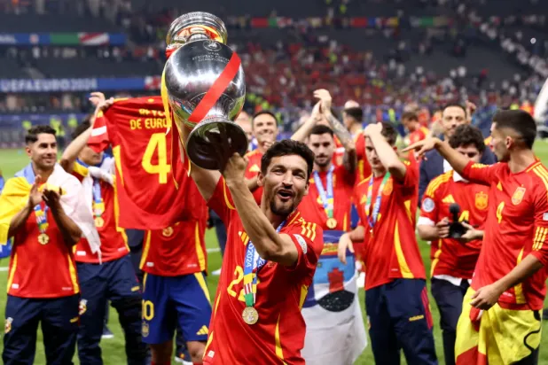 Jesús Navas celebrates with the trophy in Berlin after Spain beat England to win Euro 2024. Photograph: Matt McNulty/Uefa/Getty Images via The Guardian Sport