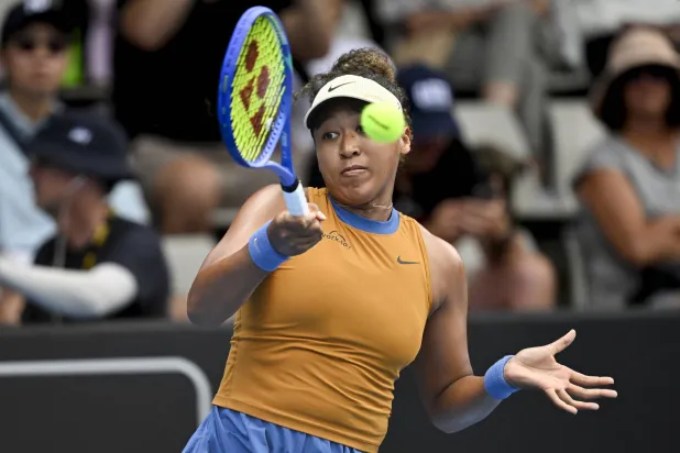 Naomi Osaka of Japan plays a shot against Julia Grabher of Austria in their women's singles match of the ASB Classic tennis tournament at Manuka Doctor Arena in Auckland, New Zealand on Wednesday, Jan. 1, 2025. (Alan Lee/Photosport via AP)