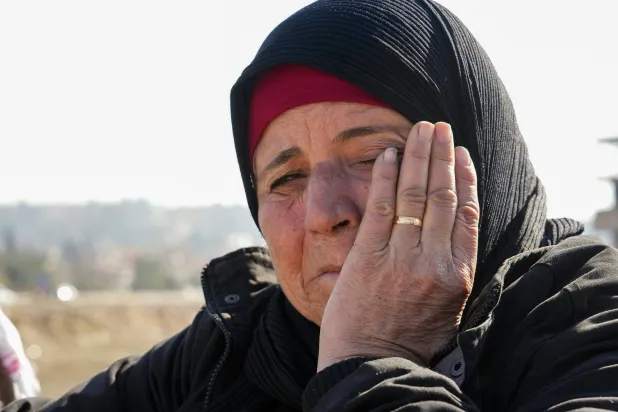 Syrians gather outside a prison in Damascus the day after Assad’s fall, hoping to uncover the fate of their missing loved ones (AFP)