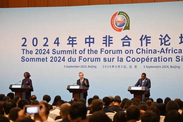 Chinese Foreign Minister Wang Yi (C) speaks during a press conference with Senegal's Foreign Minister Yassine Fall (L) and Congo Foreign Minister Jean-Claude Gakosso (R) at the Forum on China-Africa Cooperation (FOCAC) in Beijing on September 5, 2024. (Photo by GREG BAKER / AFP)