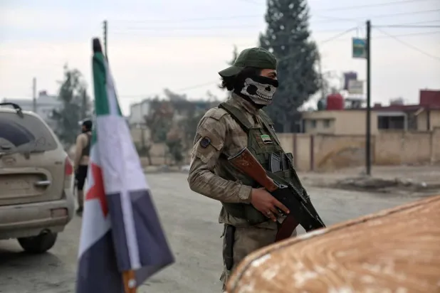 Syrian opposition fighters secure the area near Manbij city, northern Syria, 04 January 2025. (EPA)