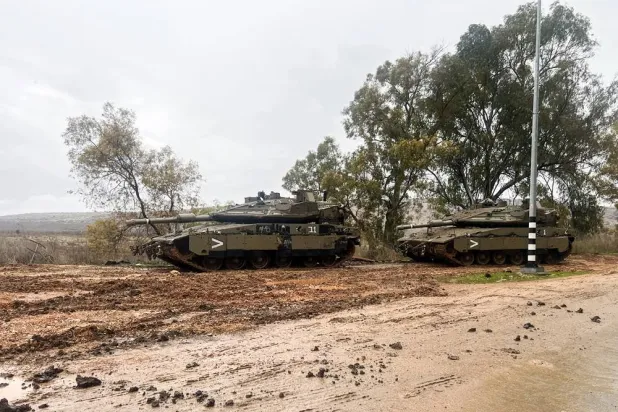 Israeli tanks are seen on a road following the ceasefire between Israel and the Iran-backed group Hezbollah, near the Israel-Lebanon border in northern Israel, December 29, 2024. (Reuters)