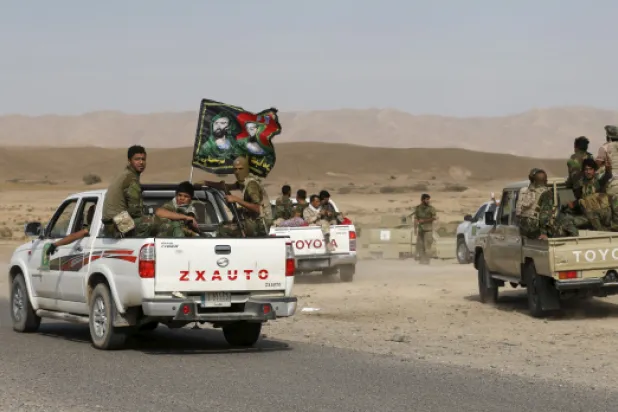 عناصر من الميليشيات الإيرانية في سوريا (المرصد السوري لحقوق الإنسان)