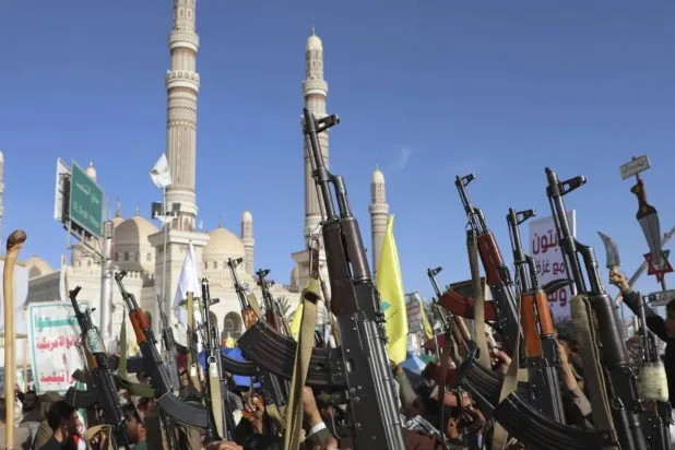 Houthis demonstrate in the center of the capital Sanaa against American and British strikes on their positions. (AP)