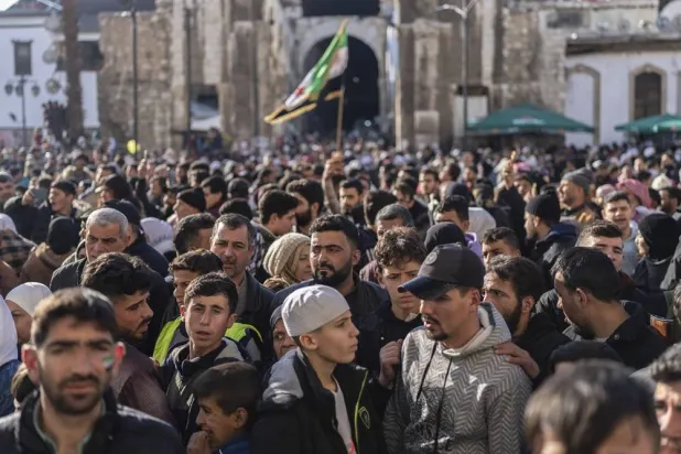 A crowd gathers outside the Umayyad Mosque as they await updates following a stampede that occurred during Friday prayers in Damascus, Syria, Friday Jan. 10, 2025. (AP)