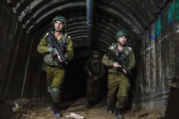 Israeli soldiers are seen in a tunnel that the military says was used by Hamas to attack the Erez crossing in the northern Gaza Strip, December 15, 2023. (AP) 
