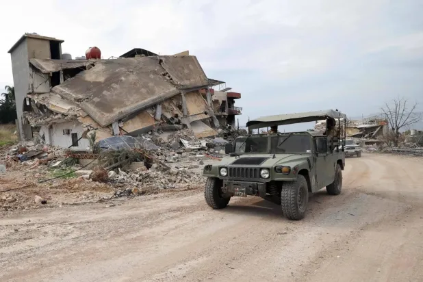 A Lebanese Army vehicle near a destroyed position in the town of Naqoura in South Lebanon (AFP)