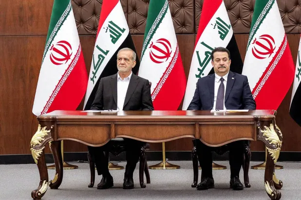 السوداني ويزشكيان خلال زيارة رئيس الوزراء العراق لإيران (آ ف ب)