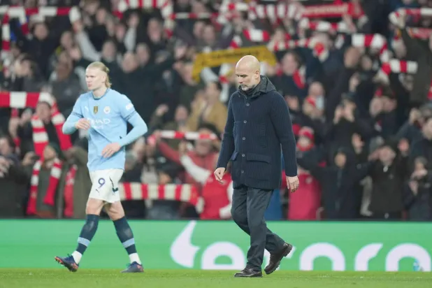 غوارديولا وهالاند وخروج بالحسرة بعد الهزيمة من آرسنال (أ.ب)