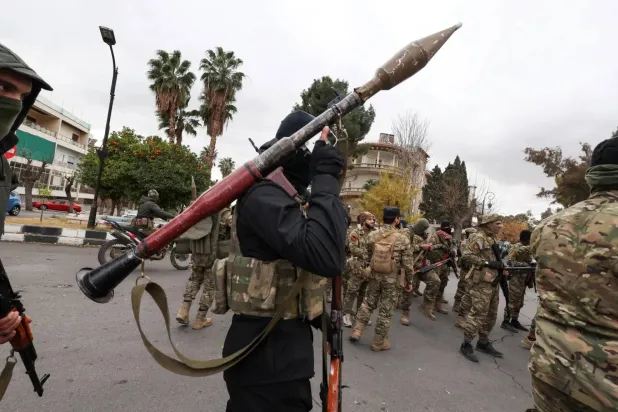 Fighters from Hayat Tahrir al-Sham in Damascus (Reuters file photo)