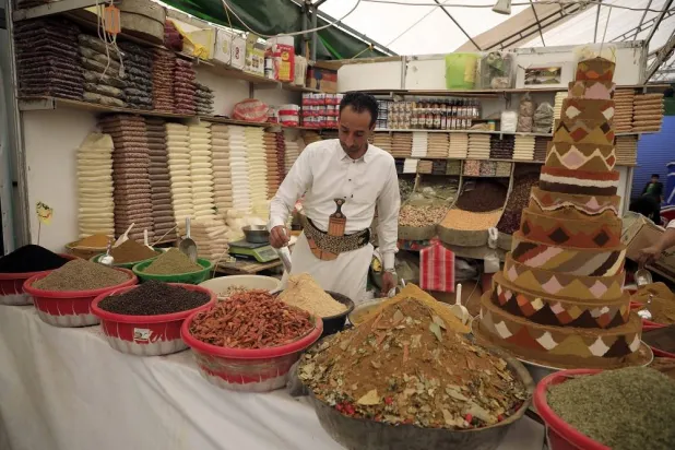 A vendor displays different types of spices for sale at a market amid rising inflation, in Sanaa, Yemen, 09 February 2025. (EPA)