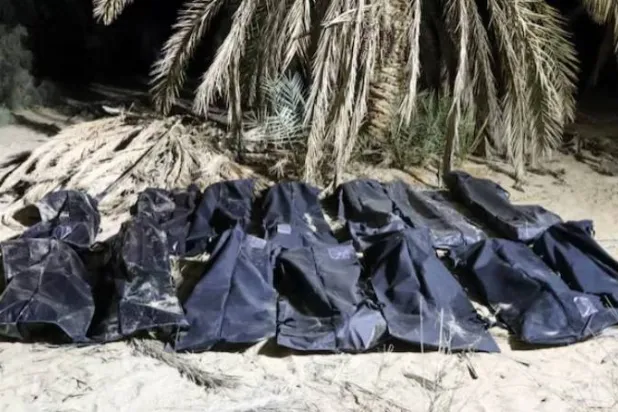 Bodies of migrants lie in bags, after they were discovered in a mass grave in a farm in Jakharra area, some 441 km from Benghazi, in Jakharra, Libya, February 5, 2025. Alwahat district Security Directorate/Handout via REUTERS