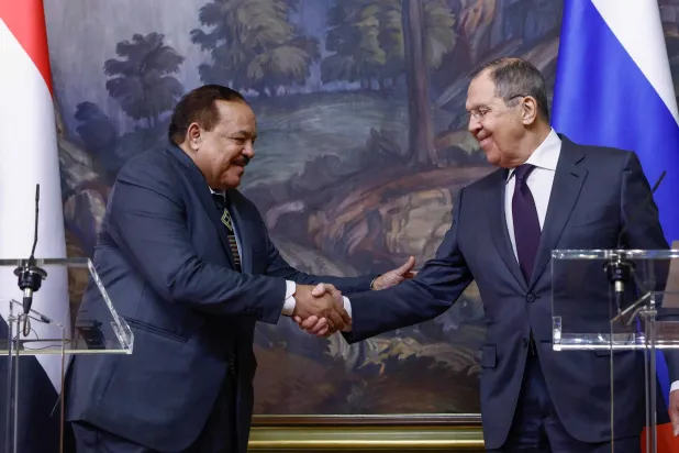 Russian Foreign Minister Sergei Lavrov (R) and his Sudanese counterpart Ali Yusuf al-Sharif shake hands during press conference in Moscow, on February 12, 2025. (Photo by Maxim Shemetov / POOL / AFP)