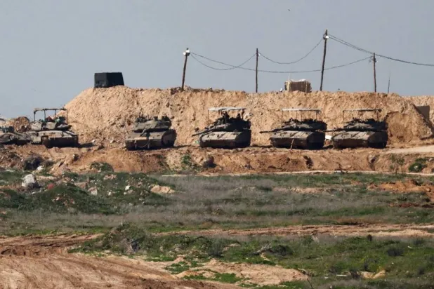 Israeli tanks are seen in Gaza Monday. (Reuters)