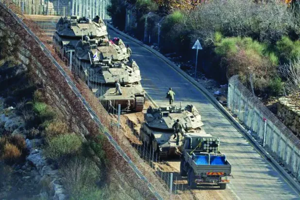 Geçtiğimiz aralık ayında Kuneytra kırsalındaki Jabata al-Khashab kasabasına yapılan bir saldırı (AFP)