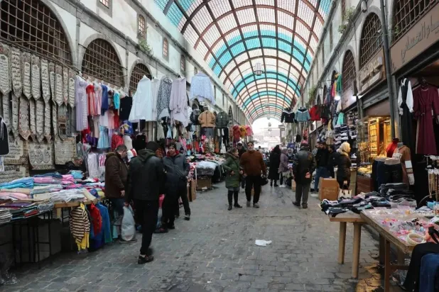 People are seen in the historic market in Homs. (Asharq Al-Awsat) 