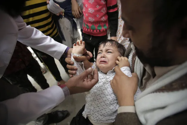 FILED - 24 April 2019, Yemen, Sanaa: A Yemeni boy receives a cholera vaccination during a house-to-house immunization campaign. Photo: Hani Al-Ansi/dpa