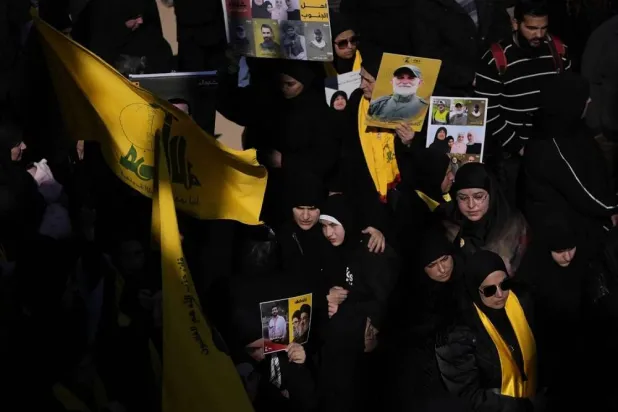Hezbollah supporters are seen at a mass funeral for 100 people killed in Aitaroun in southern Lebanon during the latest war with Israel. (AP)