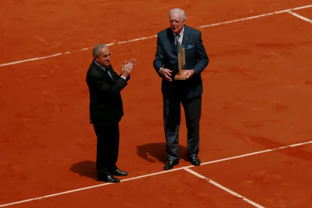 FILE PHOTO: Tennis - French Open - Roland Garros, Paris, France - 30/5/15  Mens Singles -  Former Austrailan player Fred Stolle is presented with an award by FFT President Jean Gachassin. Action Images via Reuters / Jason Cairnduff  Livepic/File Photo