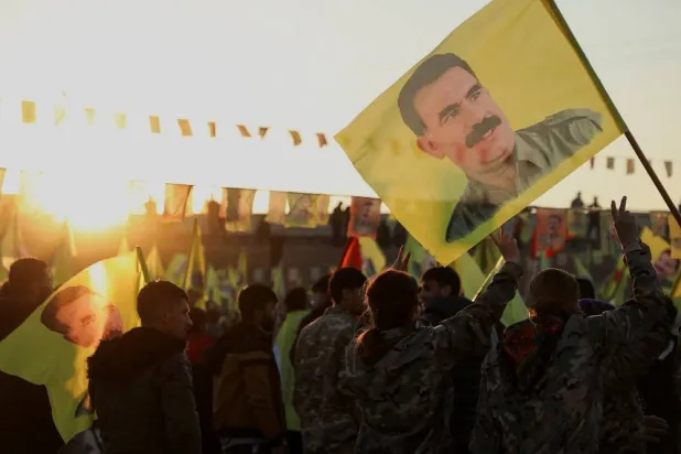 Syrian Kurds hold flags as they gather after Türkiye’s jailed militant leader Abdullah Ocalan called on his Kurdistan Workers’ Party (PKK) to lay down its arms, in Hasakah, Syria February 27, 2025. (Reuters) 