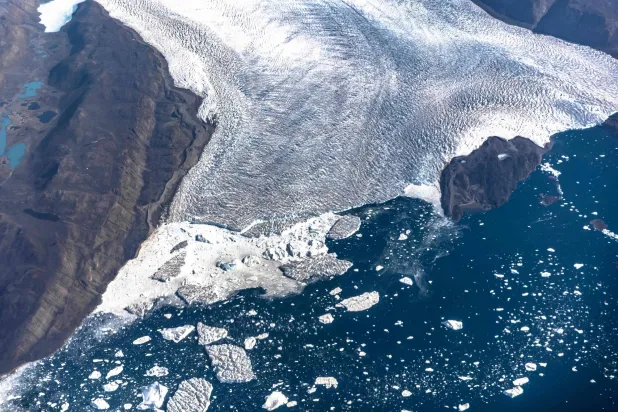 (FILES) An aerial view of icebergs and ice sheet in the Baffin Bay near Pituffik, Greenland on July 19, 2022 as captured on a NASA Gulfstream V plane while on an airborne mission to measure melting Arctic sea ice. (Photo by Kerem Yücel / AFP)