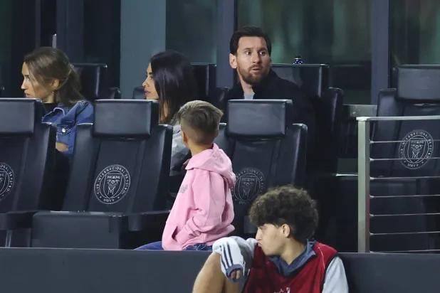 FORT LAUDERDALE, FLORIDA - MARCH 06: Lionel Messi #10 of Inter Miami CF alongside Antonela Roccuzzo observe from the sidelines during the 2025 Concacaf Champions Cup Round of 16 First Leg match between Inter Miami CF and Cavalier SC at Chase Stadium on March 06, 2025 in Fort Lauderdale, Florida. Megan Briggs/Getty Images/AFP 