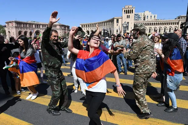  Supporters of Armenian opposition leader Nikol Pashinyan dance at the central square of Yerevan on May 2, 2018. - Tens of thousands of Armenians on May 2 converged on the capital, blocking roads and government buildings, as popular anger exploded over the ruling party's rejection of opposition leader Nikol Pashinyan's premiership bid. In an unprecedented show of defiance, protesters paralysed Yerevan, with nearly all streets closed to traffic and many stores shut. (Getty Images)
